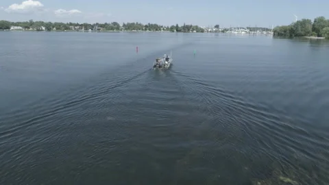 Push Into Boat Sitting on the Lake - Drone Footage Stock Footage 149506466