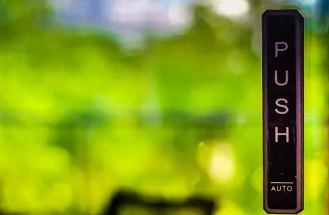 Push Button Door Lock. the automatic door with green tree garden nature bac.. Stock Photos