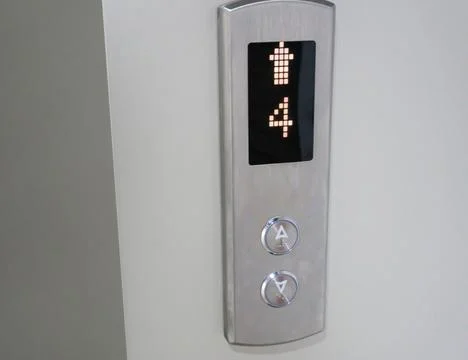 Push button for elevator up and down floor 4 in front of the door Fotos de archivo