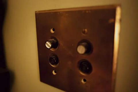 Push button light switches on the wall Stock-Fotos