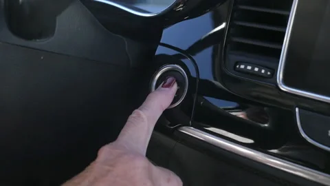 Push button start on a modern day car Stock Footage 220736444