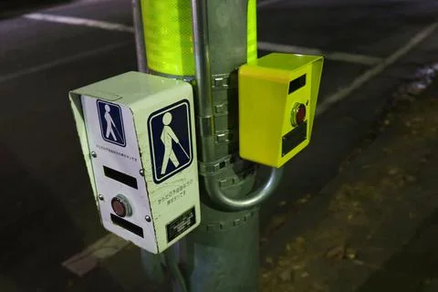 Push-button traffic light at night. Stock Photos