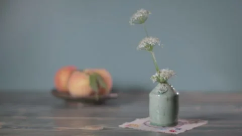 Push in with a ceramic vase containing flowers Stock Footage 344346026