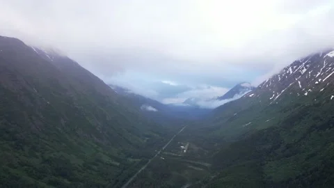 Push Into Cloudy Mountain Valley in Alaska Video stock 217831491
