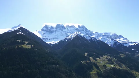 Push in drone shot of Dents du Midi mountain range with snow and cloud during Stock Footage 305732580