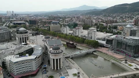 Push in Drone Shot of the River and Ships on the Skopje Cityscape Stock Footage 214313289