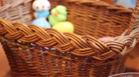 Push In To Easter Eggs and Bunny / Duck Candy In Basket Stock Footage 63010302
