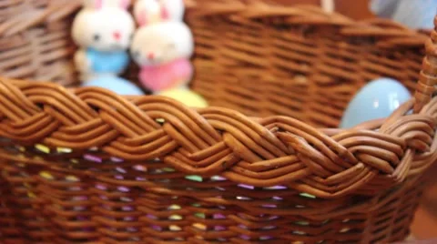 Push In To Easter Eggs and Duck Candy In Basket Stock Footage 63010814
