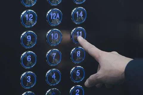 Push the elevator button 11th Stock Photos