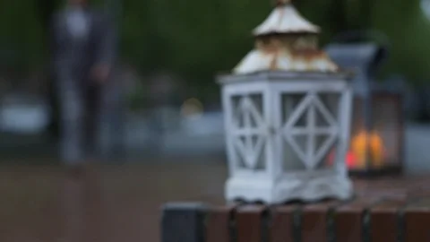 Push In Focus Shot Off A Latern Getting Picked Up By A Man Stock Footage 126701170