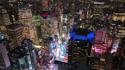 Push in high angle aerial of Times Square skyscrapers at night Vídeo Stock 344588428