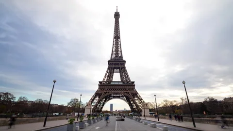 Push in Hyperlapse of Eiffel Tower in Paris with tourists and traffic on a Stock Footage 328574149
