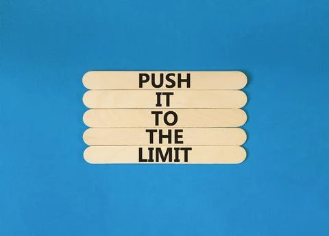Push it to the limit symbol. Concept words Push it to the limit on wooden s.. Foto stock