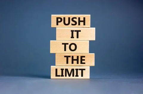 Push it to the limit symbol. Concept words Push it to the limit on wooden b.. Stock Photos