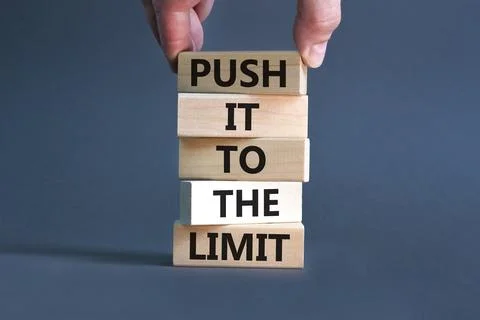 Push it to the limit symbol. Concept words Push it to the limit on wooden b.. 스톡 사진
