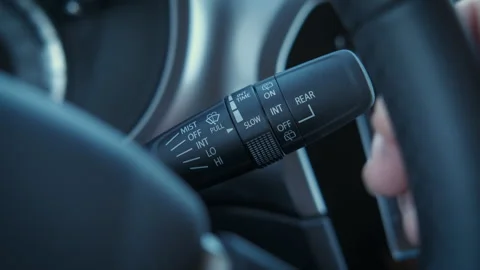 Push the lever of windshield washers. Vídeos de archivo 304758032