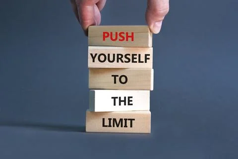 Push the limit symbol. Concept words Push yourself to the limit on wooden b.. Stock Photos