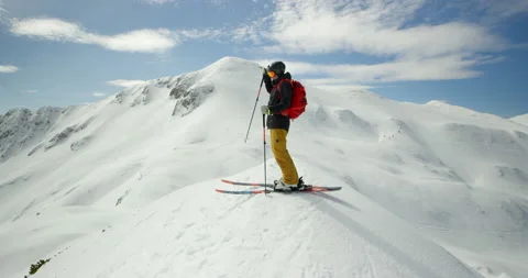 Push In Of Man Preparing For Skiing Stock Footage 140195684