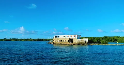 A push out close over the water of a shipwreck on a reef barrier Stock-Footage 97967063