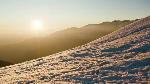 Push Out Low Shot Of Sun Warmed Idyllic Snow Surface On Top The Mountain. Stock Footage 168253369