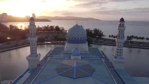 Push out shot by drone at mosque dome Kota Kinabalu city mosque Stock Footage 246804578