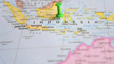 Push Pin Pointing on a Political Map Location of The Indonesia  Defocus Stock Footage 324801170