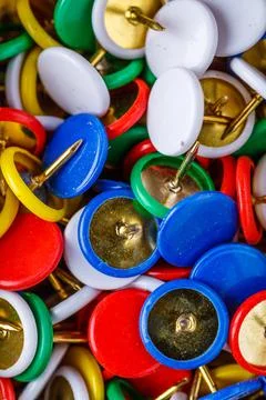 Push pins background.Set of push pins in different colors.Top view. Stock Photos