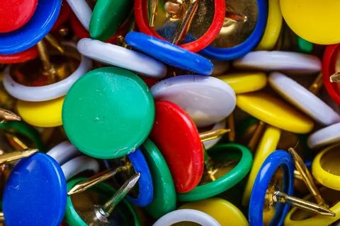 Push pins background.Set of push pins in different colors.Top view. Stock Photos