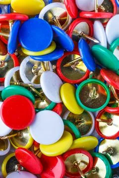 Push pins background.Set of push pins in different colors.Top view. Stock Photos