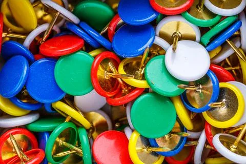 Push pins background.Set of push pins in different colors.Top view. Stock Photos