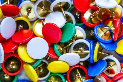 Push pins background.Set of push pins in different colors.Top view. Stock Photos