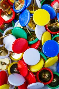 Push pins background.Set of push pins in different colors.Top view. Foto stock
