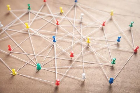 Push pins connected with thread. Network Stock Photos
