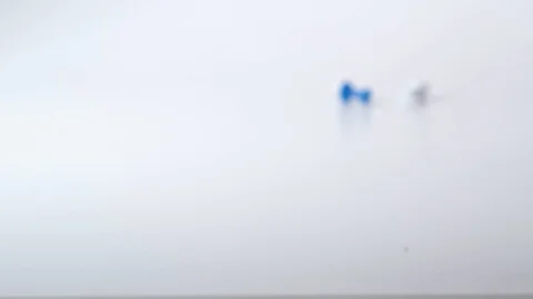 Push pins of various colours roll into frame Stock Footage 117350234