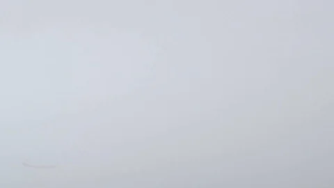 Push pins of various colours rolling over a white surface in slow motion Stock Footage 117350153