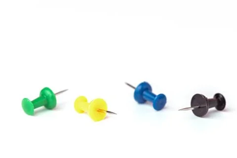 Push pins on white background Stock Photos
