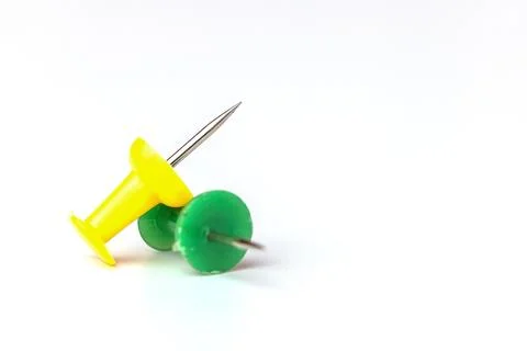 Push pins on white background Stock Photos