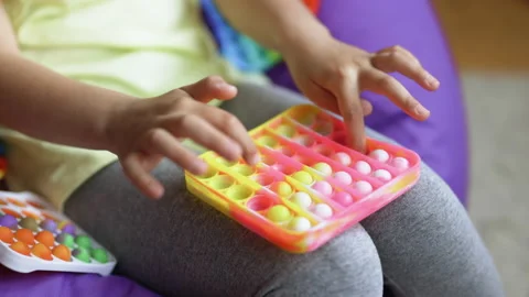 Push pop bubble fidget toys. Stress relief toys squeeze sensory toys for kids Stock Footage 194747485