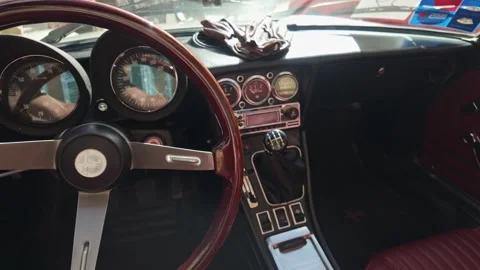 Push-in shot of Alfa Romeo Spider's dashboard at Style and Elegance event in Stock Footage 323823066