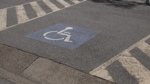 Push in shot of a disabled parking spot Stock Footage 255633672