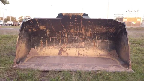 Push in shot Front view of yellow scraped marked wheel loader, scraper and grade Stock Footage 263902046