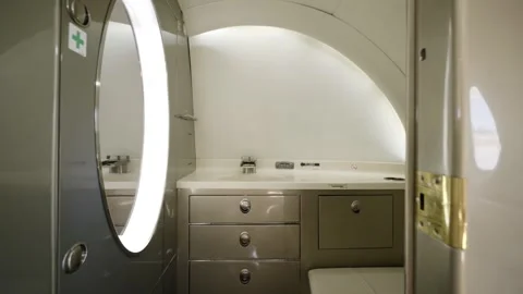 Push in shot of private jet restroom with luxury amenities. Enclosed lavatory Stock Footage 254950745