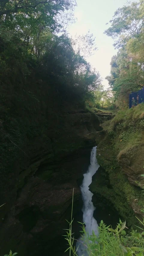 Push-In Shot of a Serene Small Waterfall in Pokhara, Nepal Stock Footage 297086021