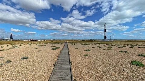 Push in shot of the shingle beach and wooden boardwalk Stock Footage 281485483