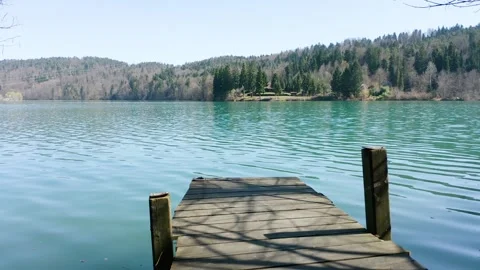 Push in Shot Of  Small Wooden Dock, Bridge, Pier, Jetty Standing At Zbilje Lake. Stock Footage 249753587