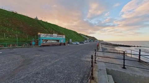 Push in shot towards a mobile fish and chip bar on the promenade 스톡 동영상 255538397