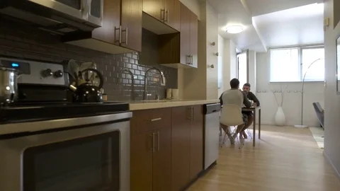 Push-in shot of two men having breakfast 動画素材 76540720