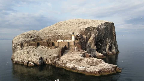 Push-in then pull-out establishing shot of Bass Rock, North Berwick, Scotland Stock Footage 306981829