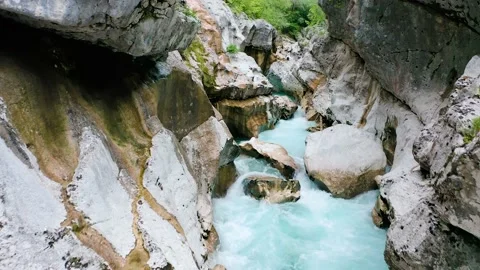 Push in Tilting Up Shot Of Famous, Unique Soča Gorge With Soča River Floating. Stock Footage 231202248