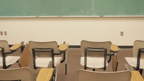 Push in Towards Chalkboard in Empty Classroom Stock Footage